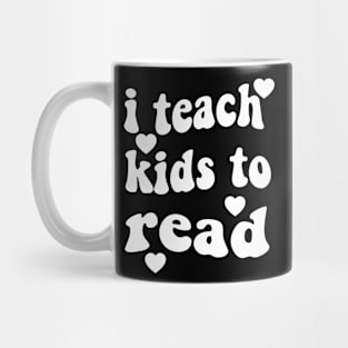 i teach kids to read  Teacher Life  Love Heart Mug